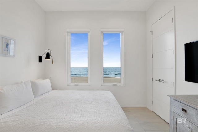 bedroom with light tile patterned floors
