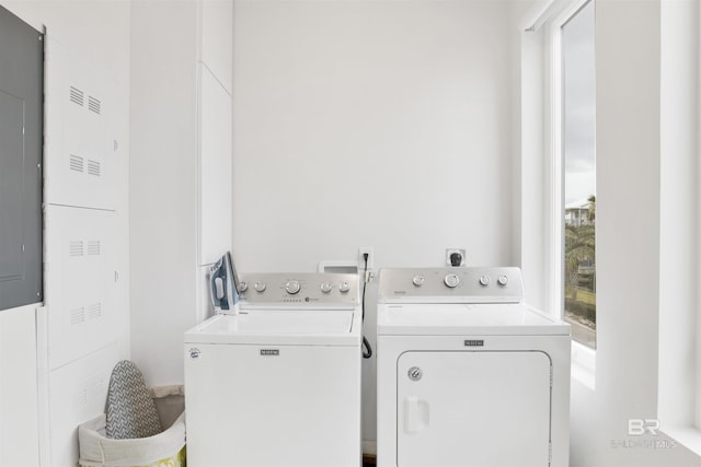 clothes washing area featuring washer and dryer