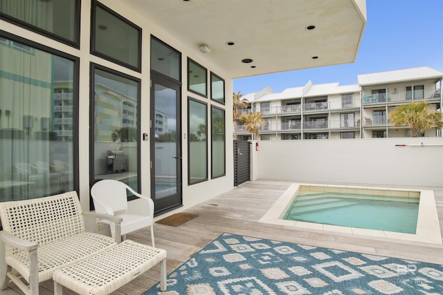 view of pool featuring a hot tub