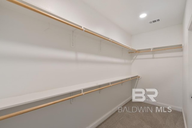 walk in closet with carpet flooring and visible vents