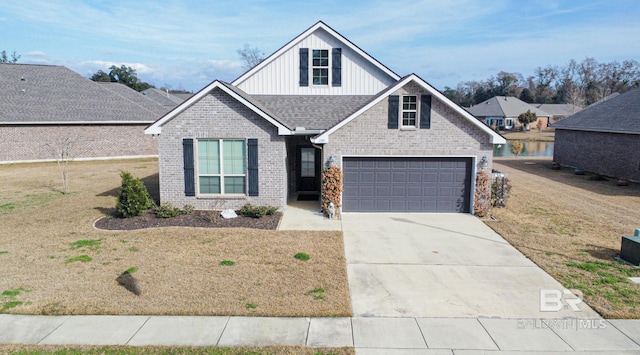 view of front of home with driveway, a garage, roof with shingles, board and batten siding, and brick siding