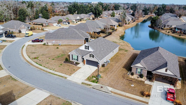 aerial view featuring a residential view and a water view