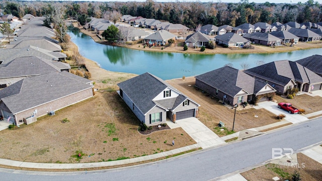 aerial view featuring a water view and a residential view