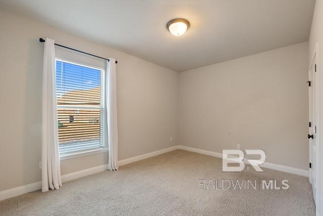 carpeted empty room with a wealth of natural light