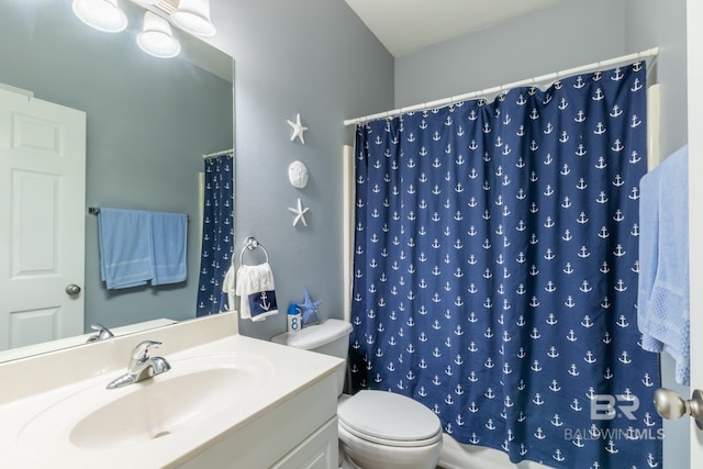 bathroom with a shower with shower curtain, vanity, and toilet