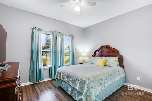 bedroom with ceiling fan and dark hardwood / wood-style flooring