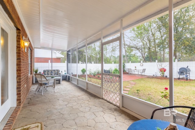 unfurnished sunroom with a wealth of natural light