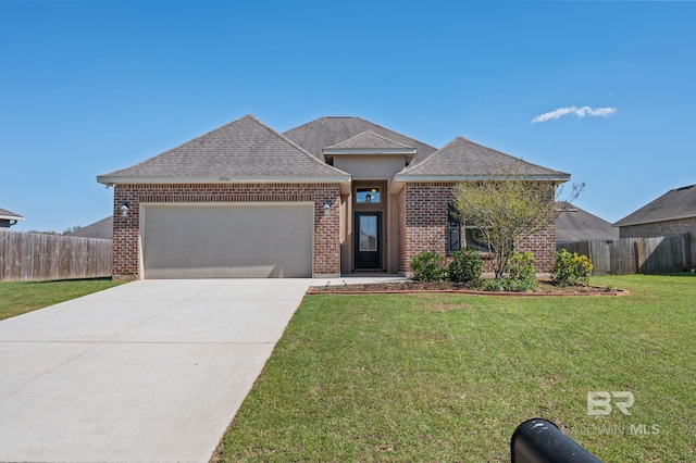 14766 Sonoma Blvd, Silverhill, AL 36576 - view of front of property with an attached garage, a front yard, brick siding, driveway, and a shingled roof