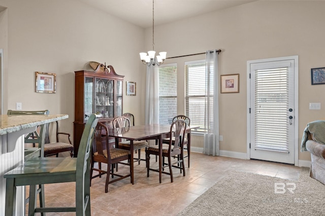 14766 Sonoma Blvd, Silverhill, AL 36576 - dining room with light tile patterned floors, baseboards, and a chandelier