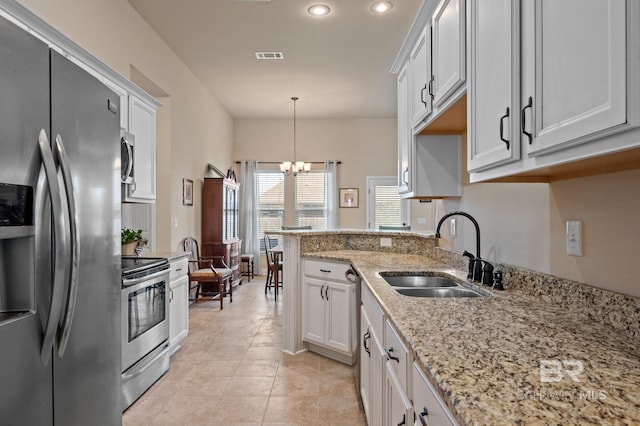 14766 Sonoma Blvd, Silverhill, AL 36576 - kitchen featuring white cabinetry, a sink, stainless steel appliances, and a notable chandelier