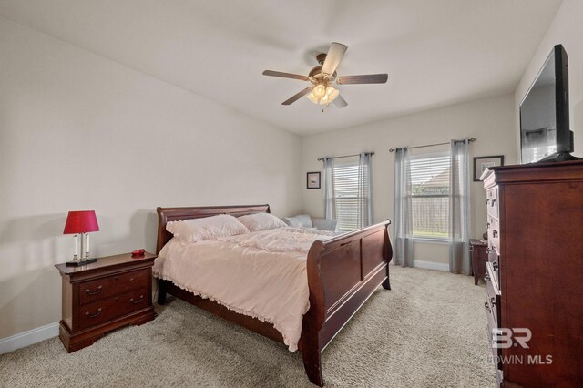 14766 Sonoma Blvd, Silverhill, AL 36576 - bedroom featuring light colored carpet, ceiling fan, and baseboards