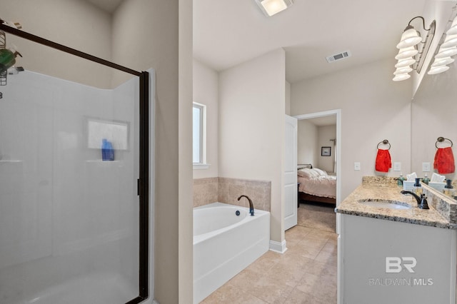 14766 Sonoma Blvd, Silverhill, AL 36576 - ensuite bathroom featuring tile patterned floors, a stall shower, ensuite bath, and a garden tub