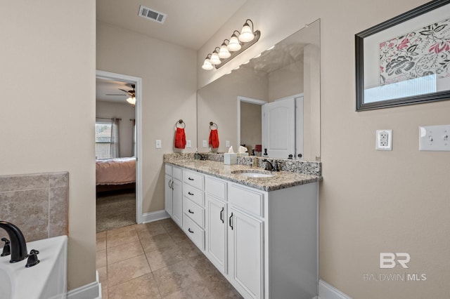 14766 Sonoma Blvd, Silverhill, AL 36576 - ensuite bathroom featuring a sink, ensuite bath, visible vents, ceiling fan, and double vanity