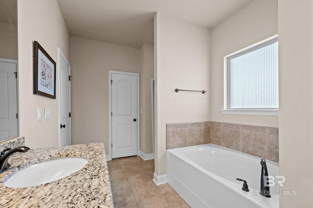 14766 Sonoma Blvd, Silverhill, AL 36576 - full bathroom with tile patterned floors, vanity, baseboards, and a garden tub