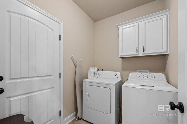 14766 Sonoma Blvd, Silverhill, AL 36576 - laundry room with cabinet space, baseboards, and separate washer and dryer