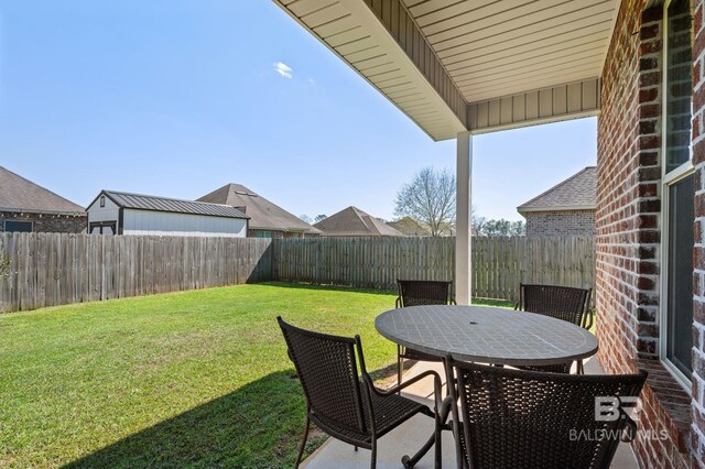 14766 Sonoma Blvd, Silverhill, AL 36576 - view of yard featuring a fenced backyard and outdoor dining area