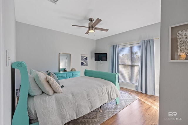 bedroom featuring hardwood / wood-style floors and ceiling fan