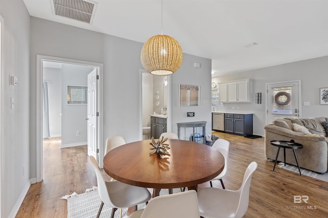 dining area with light hardwood / wood-style flooring