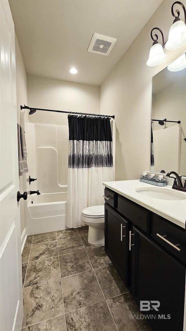 full bathroom with vanity, toilet, and shower / bath combo