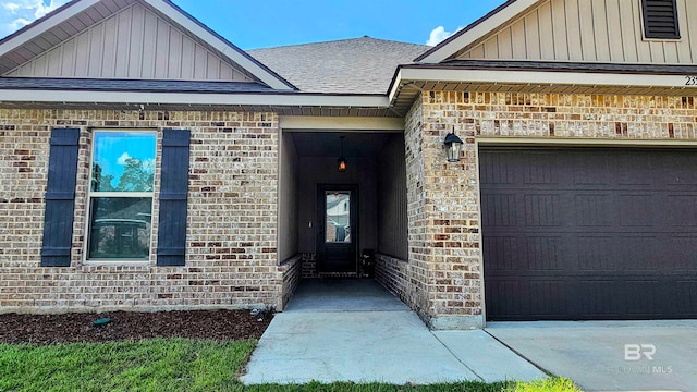 view of exterior entry featuring a garage