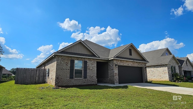 view of front of property with a garage and a front lawn