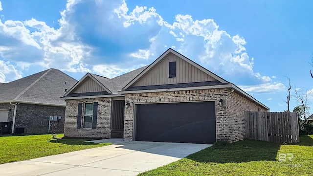 view of front of property with a front yard and a garage