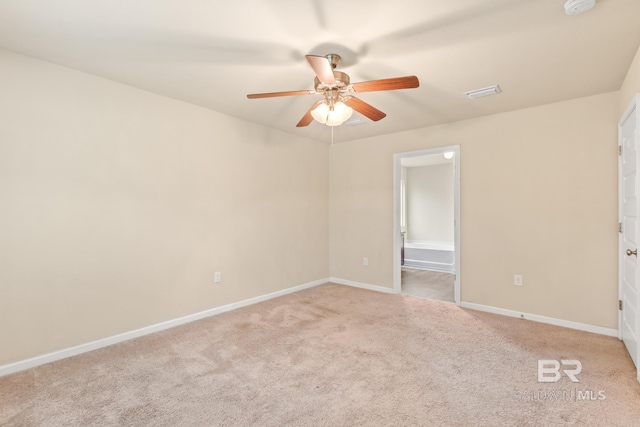 empty room with light colored carpet and ceiling fan