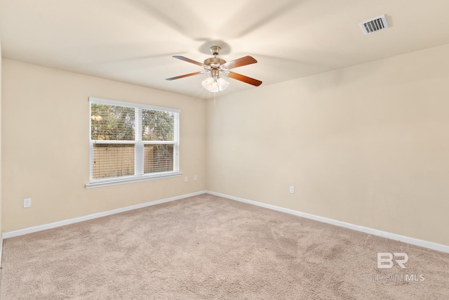 carpeted empty room with ceiling fan