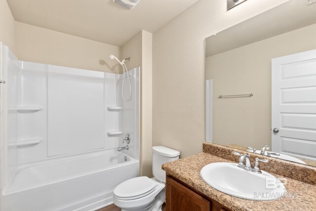 full bathroom with vanity, toilet, and shower / tub combination