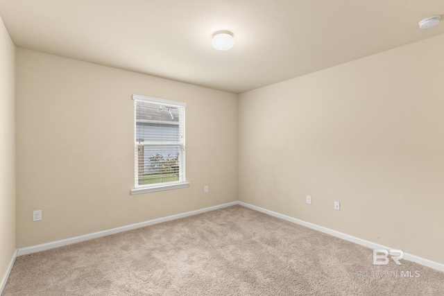 empty room with light colored carpet