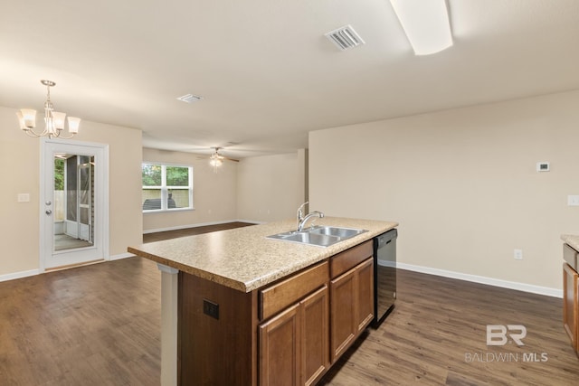 kitchen with dishwasher, sink, pendant lighting, a center island with sink, and ceiling fan with notable chandelier