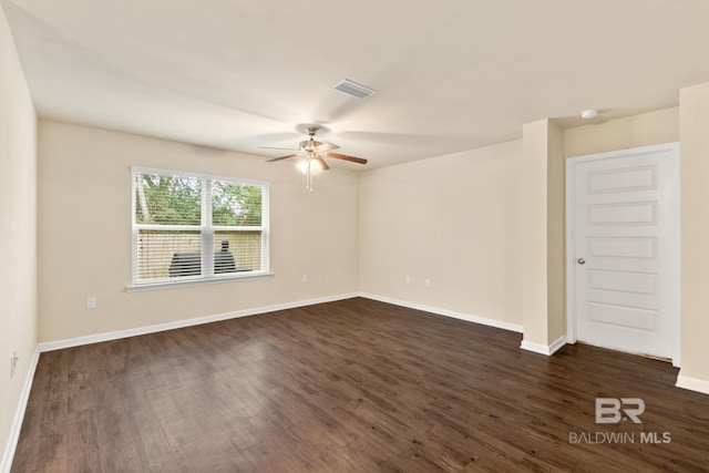 unfurnished room featuring dark hardwood / wood-style flooring and ceiling fan