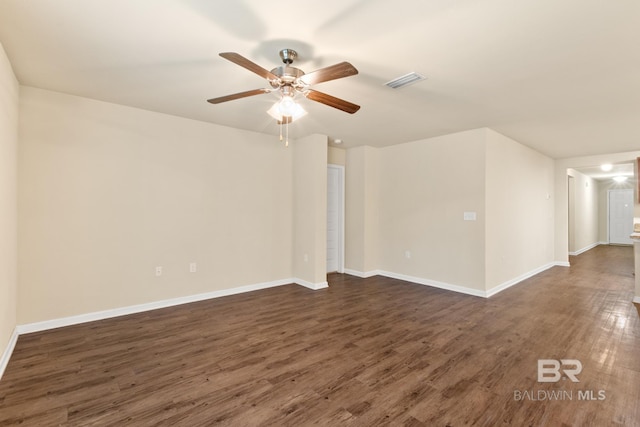 unfurnished room featuring dark hardwood / wood-style floors and ceiling fan