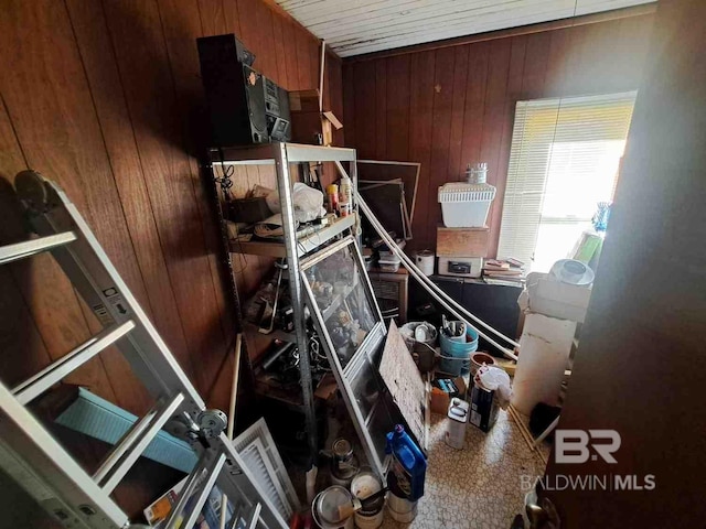 miscellaneous room with wood walls