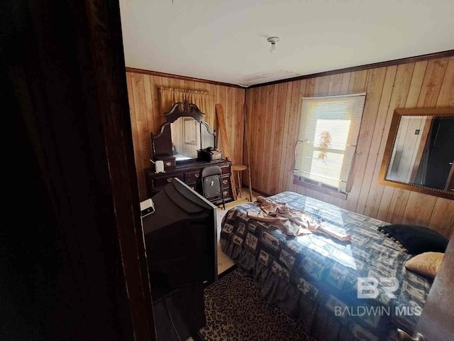 bedroom featuring wooden walls, carpet, and crown molding