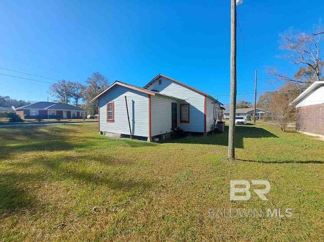 view of property exterior with a lawn