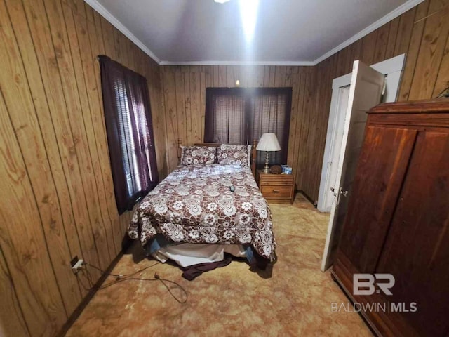 bedroom featuring carpet flooring, wood walls, and ornamental molding
