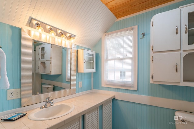 half bathroom with wood ceiling, vaulted ceiling, toilet, and wallpapered walls