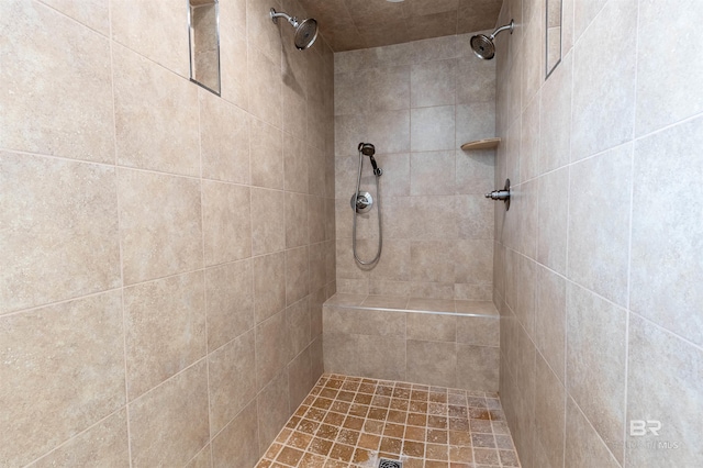 full bathroom featuring tiled shower