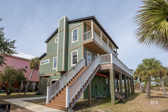 exterior space with stairs and board and batten siding