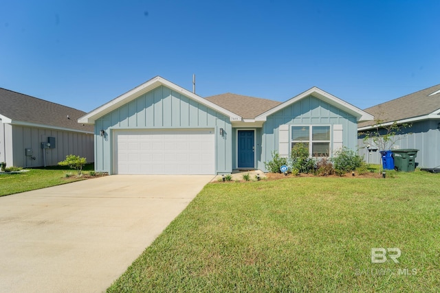 ranch-style house featuring a front lawn and a garage