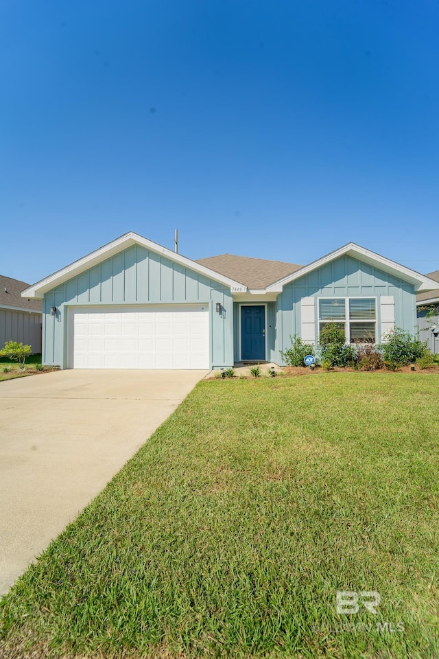 ranch-style home with a front yard and a garage