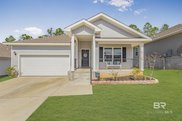 view of front of house with a porch, a garage, and a front yard