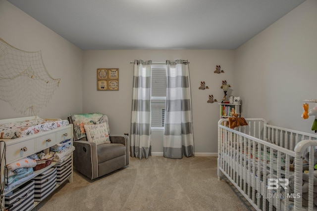 carpeted bedroom featuring a crib