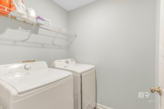 laundry room with washing machine and dryer