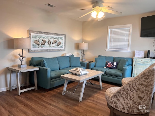 living room with ceiling fan and dark hardwood / wood-style floors