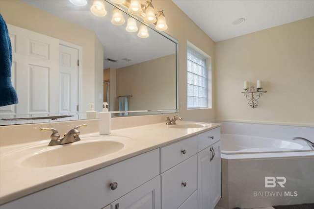 1521 E Peyton Dr, Mobile, AL 36695 - bathroom featuring double vanity and a bath