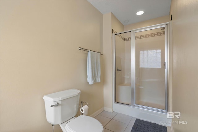 1521 E Peyton Dr, Mobile, AL 36695 - full bathroom featuring a shower stall, tile patterned flooring, toilet, and baseboards
