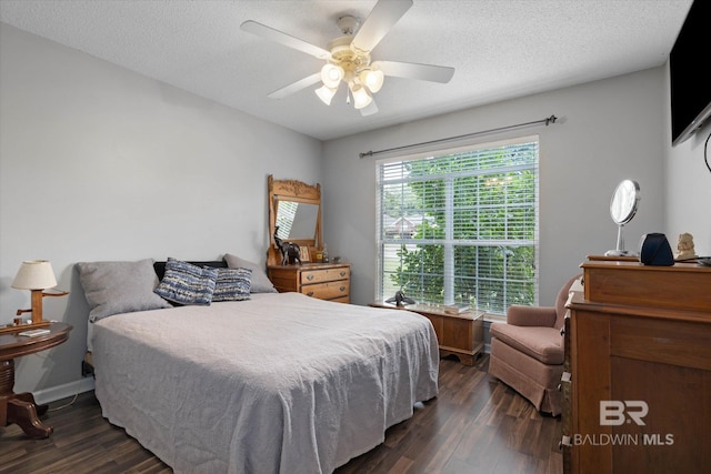 1521 E Peyton Dr, Mobile, AL 36695 - bedroom with dark wood finished floors, a ceiling fan, and a textured ceiling