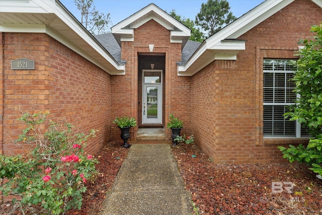 1521 E Peyton Dr, Mobile, AL 36695 - doorway to property featuring brick siding and a shingled roof